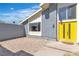 Entrance featuring a bright yellow door and a brick paver patio at 1808 Piccolo Way, Las Vegas, NV 89146
