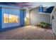 Inviting entrance with yellow door and adjacent window offering interior views at 1808 Piccolo Way, Las Vegas, NV 89146