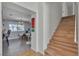 Bright entryway featuring wood stairs, dining area with modern decor, and neutral color palette at 1808 Piccolo Way, Las Vegas, NV 89146