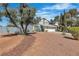 Two-story home featuring an attached two-car garage, an arched gated entrance and a xeriscaped front yard at 1808 Piccolo Way, Las Vegas, NV 89146