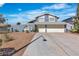 Two-story home featuring an attached two-car garage, an arched gated entrance and a xeriscaped front yard at 1808 Piccolo Way, Las Vegas, NV 89146