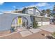 Home featuring an arched gated entrance leading to a bright yellow door and an attached two-car garage at 1808 Piccolo Way, Las Vegas, NV 89146