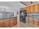 Spacious kitchen with granite countertops, wood cabinets and stainless-steel appliances at 1808 Piccolo Way, Las Vegas, NV 89146