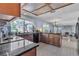 Spacious kitchen with tile floors, wood cabinets, and island with breakfast bar at 1808 Piccolo Way, Las Vegas, NV 89146