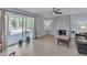 Cozy living room features a fireplace and sliding glass doors to the patio at 1808 Piccolo Way, Las Vegas, NV 89146