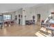 Open floor plan showing the living room and dining area with hardwood floors at 1808 Piccolo Way, Las Vegas, NV 89146