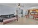 Spacious living room with modern furniture and seamless access to the dining area at 1808 Piccolo Way, Las Vegas, NV 89146