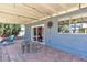 Covered patio with brick flooring and lounge seating at 1808 Piccolo Way, Las Vegas, NV 89146