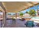 Covered patio overlooking the pool, hot tub, and backyard area at 1808 Piccolo Way, Las Vegas, NV 89146