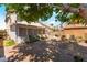 The private backyard offers a brick patio, screened porch, and plenty of seating space for relaxation and entertainment at 1922 Falcon Ridge St, Las Vegas, NV 89142