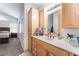 Bright bathroom with a spacious vanity and large mirror at 1922 Falcon Ridge St, Las Vegas, NV 89142