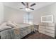 Cozy bedroom with a window, fan, and stylish light-up dresser at 1922 Falcon Ridge St, Las Vegas, NV 89142