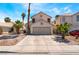 Charming two-story home featuring a two-car garage, desert landscaping, and inviting curb appeal at 1922 Falcon Ridge St, Las Vegas, NV 89142