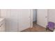 Hallway with storage cabinets and adjacent bedroom at 1922 Falcon Ridge St, Las Vegas, NV 89142