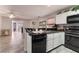 Open kitchen layout featuring stainless steel appliances, granite countertops, and open to the living area at 1922 Falcon Ridge St, Las Vegas, NV 89142