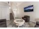 Inviting living room featuring a vaulted ceiling, modern tile floors, and comfortable seating at 1922 Falcon Ridge St, Las Vegas, NV 89142