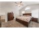 Spacious main bedroom with a ceiling fan and neutral colors at 1922 Falcon Ridge St, Las Vegas, NV 89142