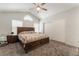 Spacious main bedroom featuring a ceiling fan and neutral colors at 1922 Falcon Ridge St, Las Vegas, NV 89142