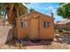 The backyard contains an outbuilding and is enhanced with a brick patio, offering versatile space for storage or hobbies at 1922 Falcon Ridge St, Las Vegas, NV 89142