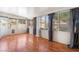 Sunroom featuring hardwood floors, many windows, and backyard access at 1922 Falcon Ridge St, Las Vegas, NV 89142