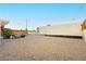 Expansive backyard with gravel landscaping, string lights, and ample space for outdoor activities at 200 E Desert Rose Dr, Henderson, NV 89015
