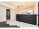 A bar area features unique lighting, modern cabinetry, and access to another room at 200 E Desert Rose Dr, Henderson, NV 89015