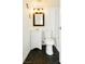 Updated bathroom featuring black hexagonal floor tiles, and classic fixtures at 200 E Desert Rose Dr, Henderson, NV 89015
