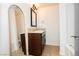 Bathroom features a modern vanity, granite countertops, and a stylish framed mirror at 200 E Desert Rose Dr, Henderson, NV 89015
