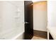 This bathroom features tiled walls, a built-in shelf, and granite countertop at 200 E Desert Rose Dr, Henderson, NV 89015