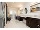 Large bathroom with double sinks, marble countertops, and a view from the glass doors at 200 E Desert Rose Dr, Henderson, NV 89015