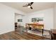 Bright bedroom featuring a modern desk, hardwood floors, and a large window at 200 E Desert Rose Dr, Henderson, NV 89015