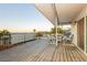 Covered deck with a view, offering a tranquil space for outdoor lounging and dining at 200 E Desert Rose Dr, Henderson, NV 89015