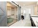 Luxury dressing room featuring an ottoman, shelving, closet and glass doors at 200 E Desert Rose Dr, Henderson, NV 89015