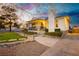 Inviting exterior with a covered porch, manicured landscaping, and a walkway that lead to the front door at 200 E Desert Rose Dr, Henderson, NV 89015