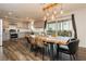 Eat in kitchen with stylish dining table, updated cabinets, stainless appliances, and backyard access at 200 E Desert Rose Dr, Henderson, NV 89015