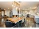 Open concept eat in kitchen with spacious layout, wood floors, and modern lighting fixtures at 200 E Desert Rose Dr, Henderson, NV 89015