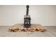 Charming wood burning stove fireplace set on brick platform in living room at 200 E Desert Rose Dr, Henderson, NV 89015