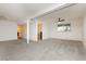 Spacious living room featuring carpet and a ceiling fan at 200 E Desert Rose Dr, Henderson, NV 89015