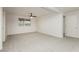 Spacious living room featuring carpet and a ceiling fan at 200 E Desert Rose Dr, Henderson, NV 89015