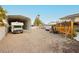 Spacious parking with RV parking under metal awning and large gravel parking area at 200 E Desert Rose Dr, Henderson, NV 89015