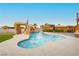 Backyard pool with slide, waterfall, and desert landscaping, perfect for outdoor fun at 200 E Desert Rose Dr, Henderson, NV 89015