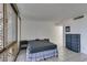 Spacious bedroom with tiled floor and large window at 205 E Harmon Ave # 112, Las Vegas, NV 89169