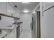 A galley kitchen featuring granite countertops, stainless appliances, and modern cabinetry at 205 E Harmon Ave # 112, Las Vegas, NV 89169
