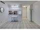 Bright kitchen features tiled flooring and a mirrored backsplash at 205 E Harmon Ave # 112, Las Vegas, NV 89169
