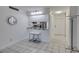 Bright kitchen featuring a mirrored pass-through and barstool seating at 205 E Harmon Ave # 112, Las Vegas, NV 89169