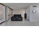 Comfortable living room featuring tiled floors and a bright sunroom at 205 E Harmon Ave # 112, Las Vegas, NV 89169