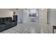 Cozy living room with tiled floors and kitchen view at 205 E Harmon Ave # 112, Las Vegas, NV 89169