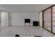 Inviting living room features sleek tile flooring and neutral walls at 205 E Harmon Ave # 112, Las Vegas, NV 89169