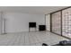 Bright living room featuring sliding glass doors and tile flooring at 205 E Harmon Ave # 112, Las Vegas, NV 89169