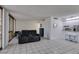 Inviting living room with access to a bright and airy sunroom at 205 E Harmon Ave # 112, Las Vegas, NV 89169